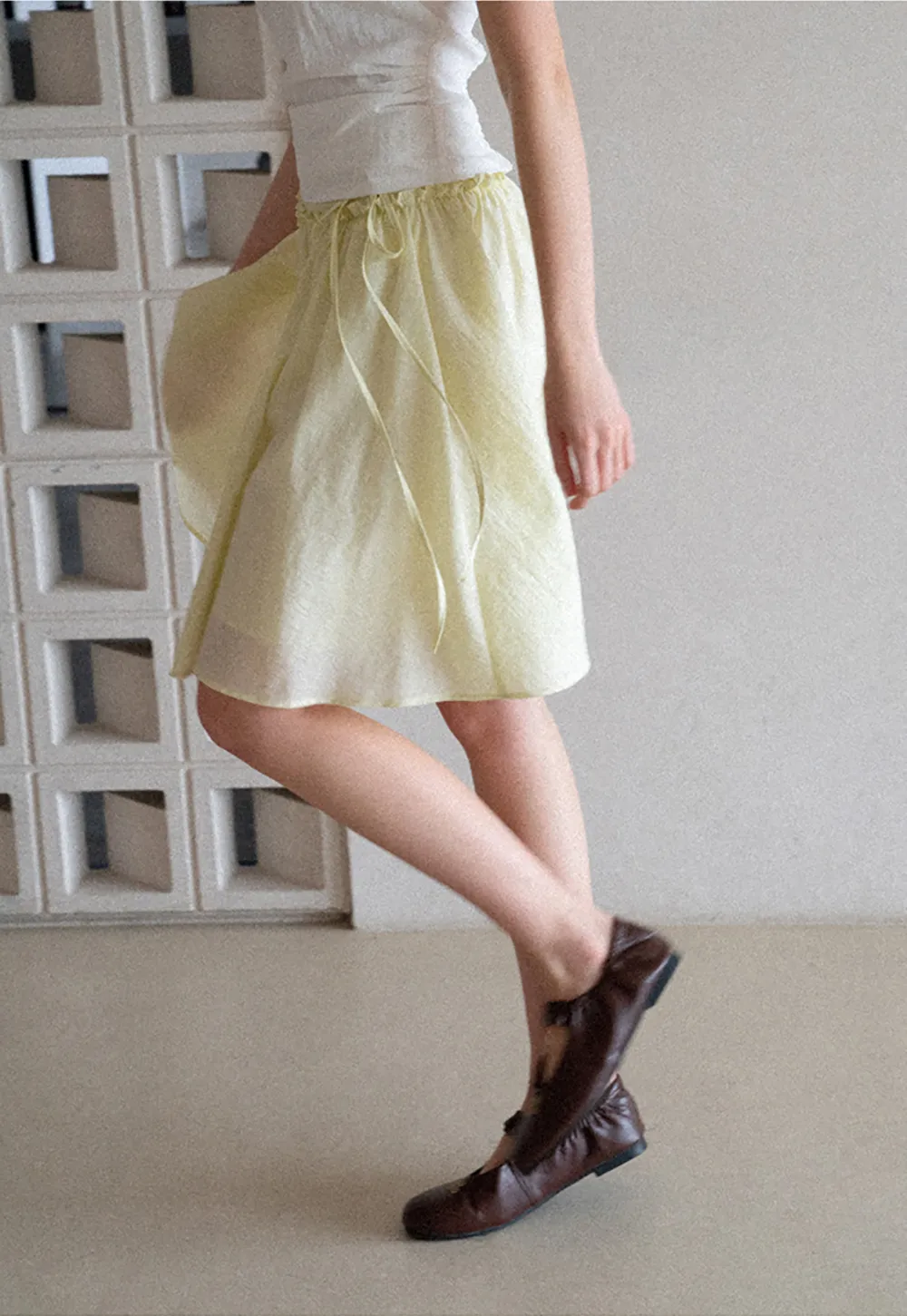 Flowy A-line skirt with gathered waist and layered hem