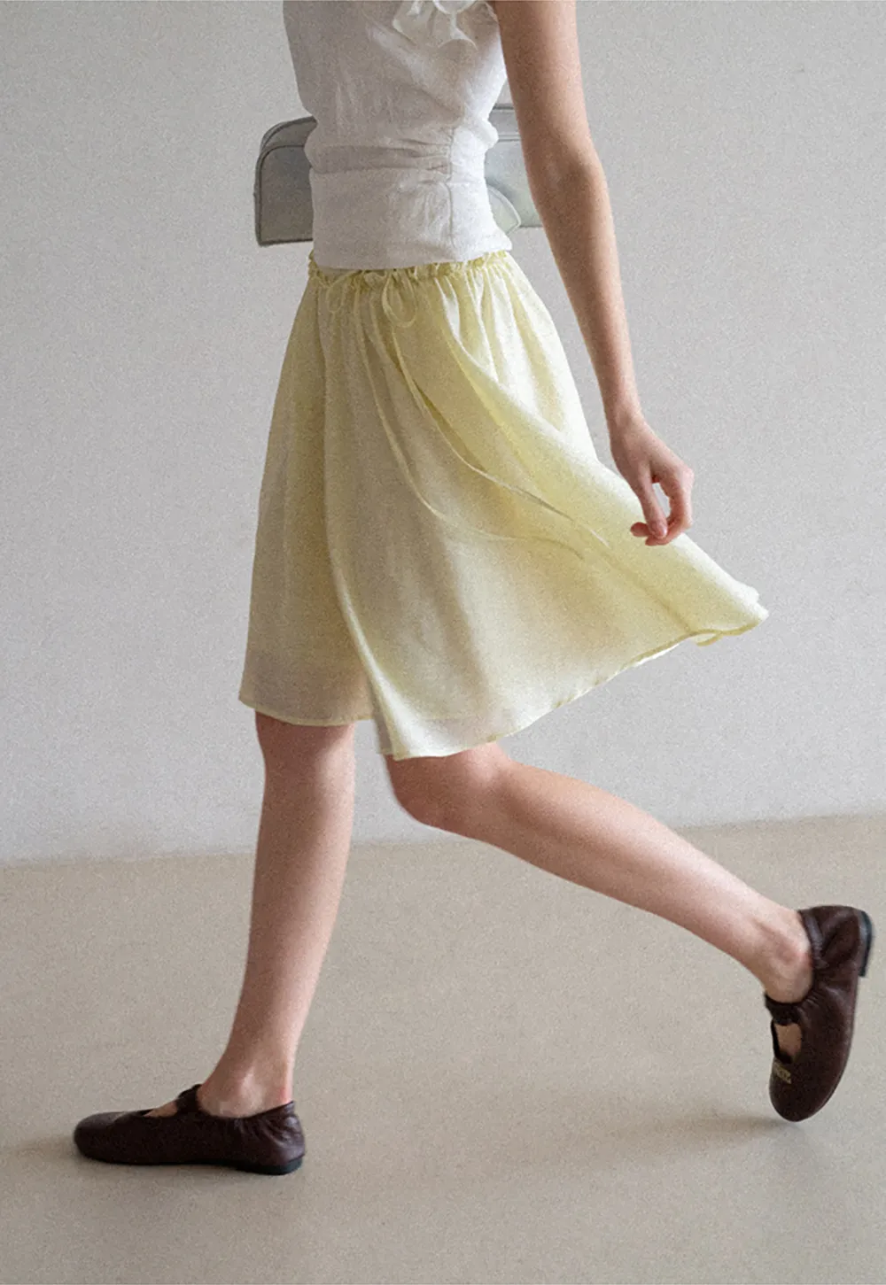 Flowy A-line skirt with gathered waist and layered hem