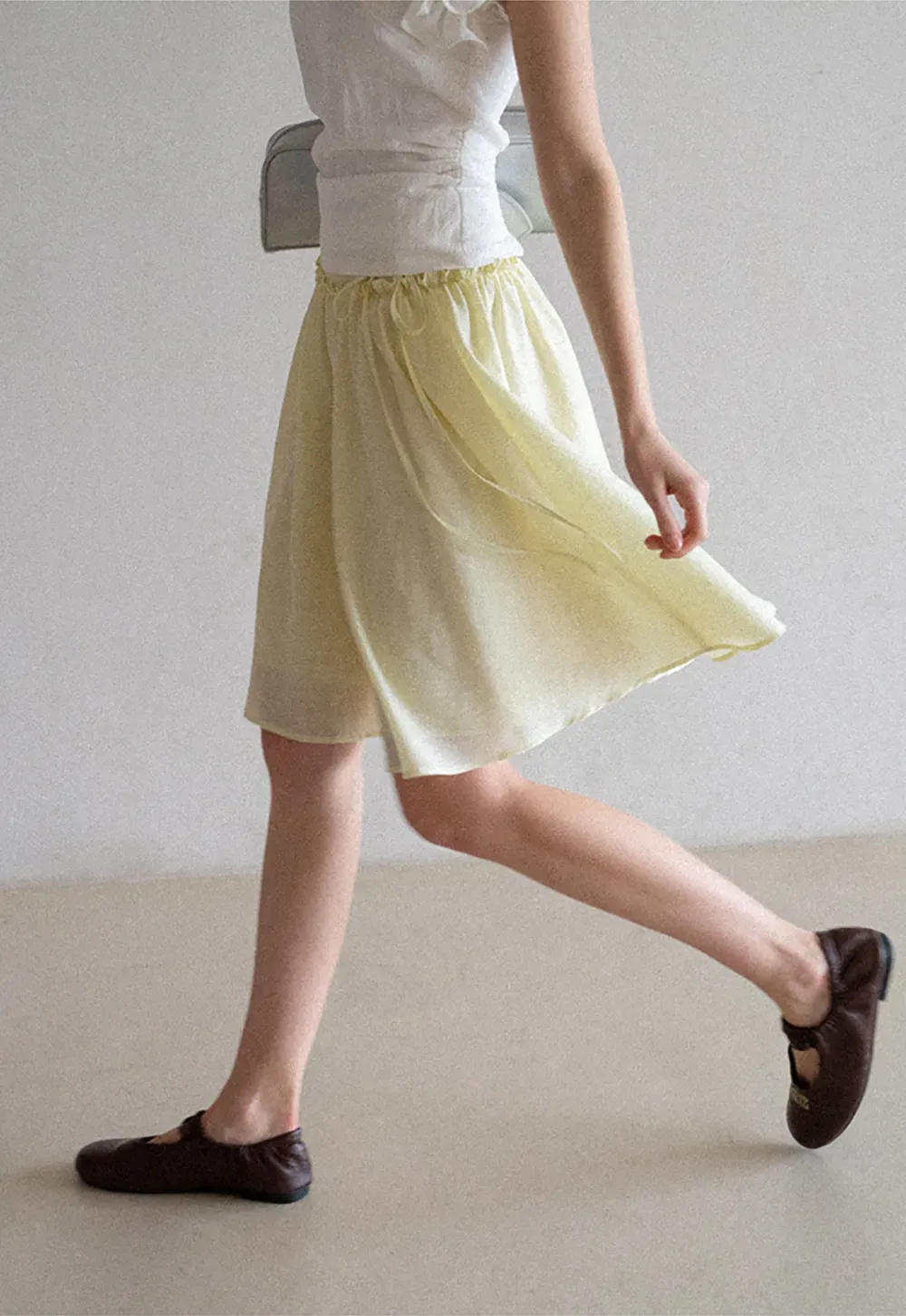 Flowy A-line skirt with gathered waist and layered hem