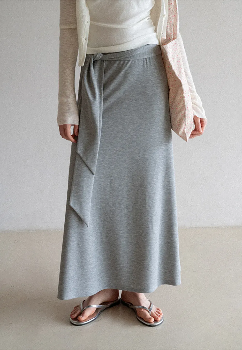Wrap style long skirt with side drape detail