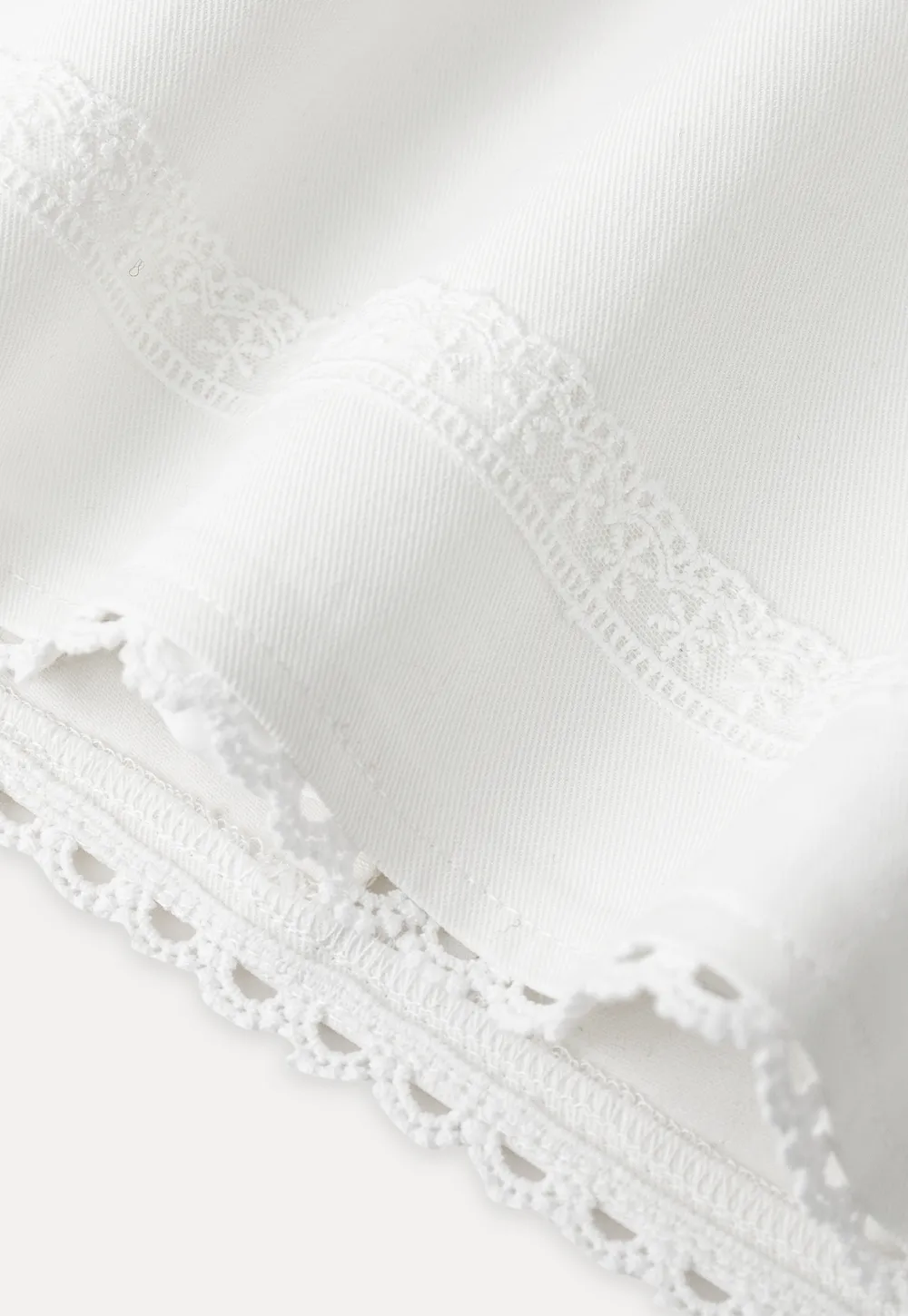 Mini skirt with lace trim at waist and hem