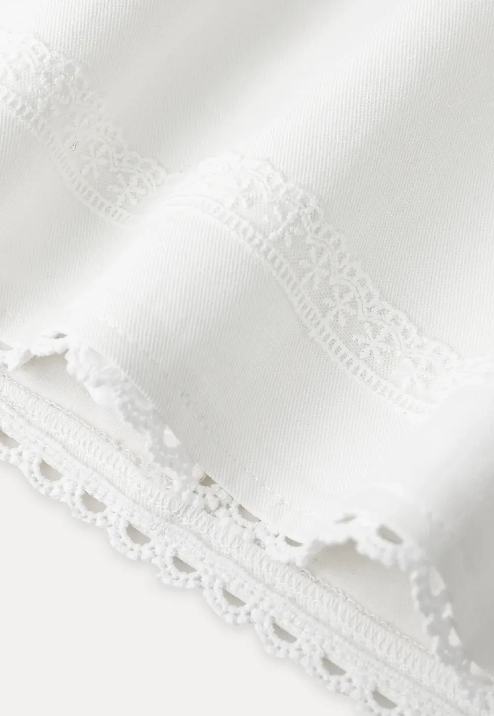 Mini skirt with lace trim at waist and hem