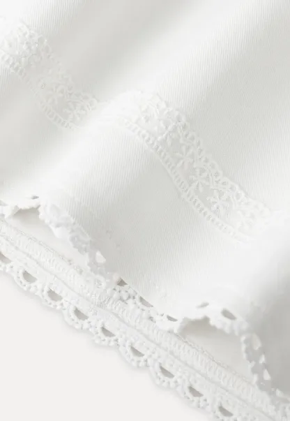 Mini skirt with lace trim at waist and hem