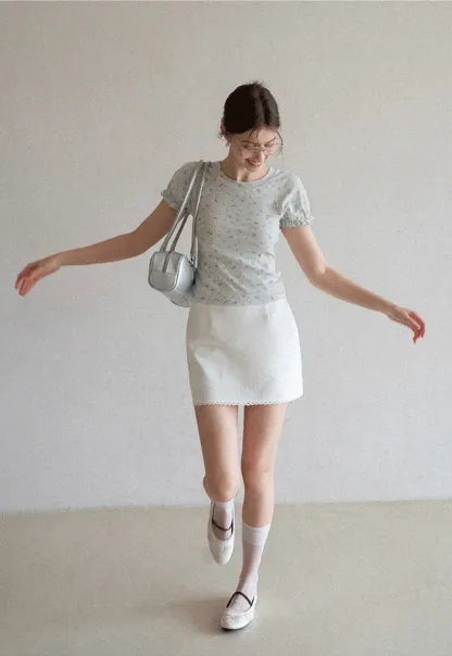 Mini skirt with lace trim at waist and hem