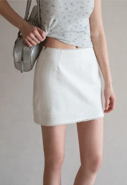 Mini skirt with lace trim at waist and hem