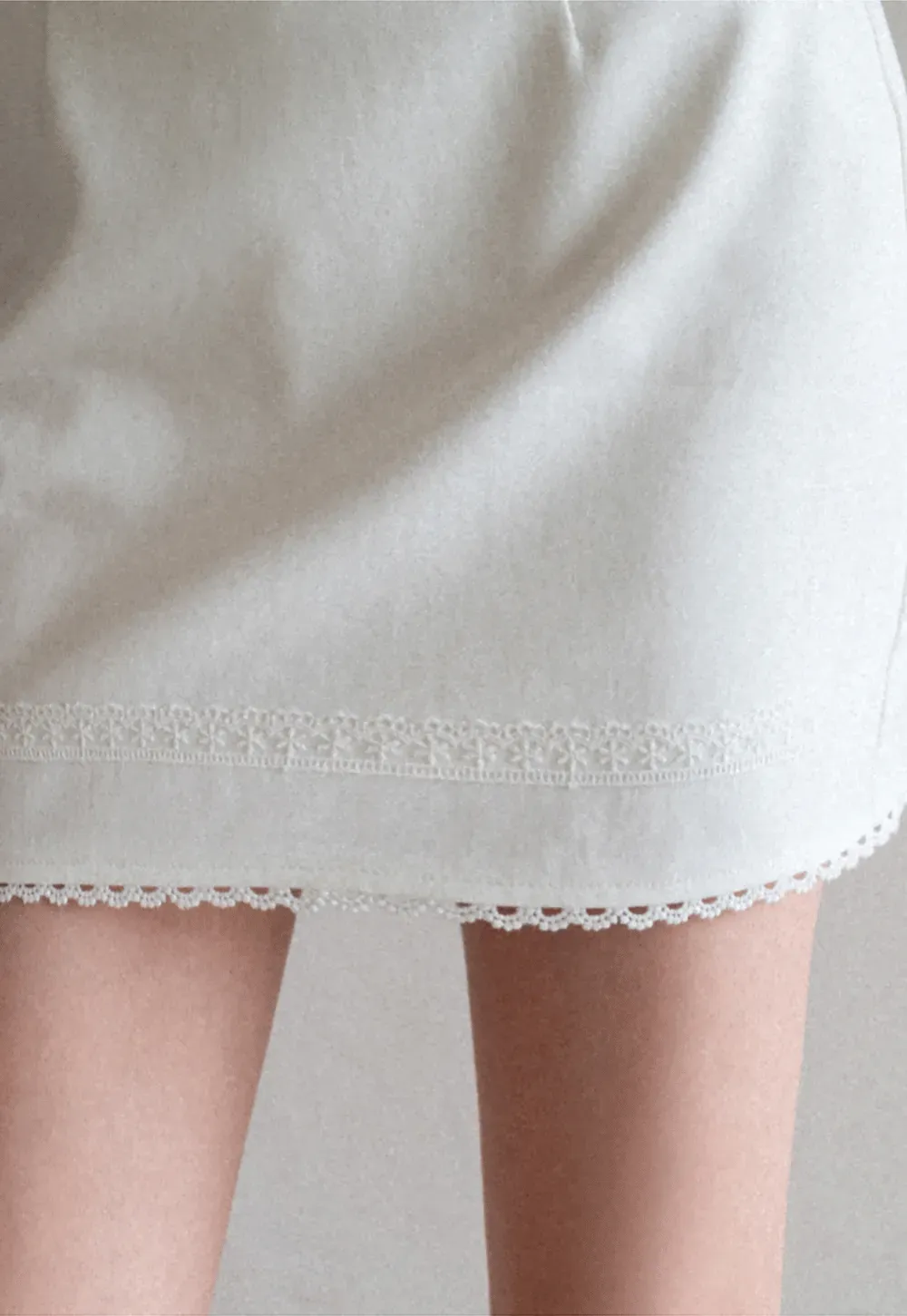 Mini skirt with lace trim at waist and hem