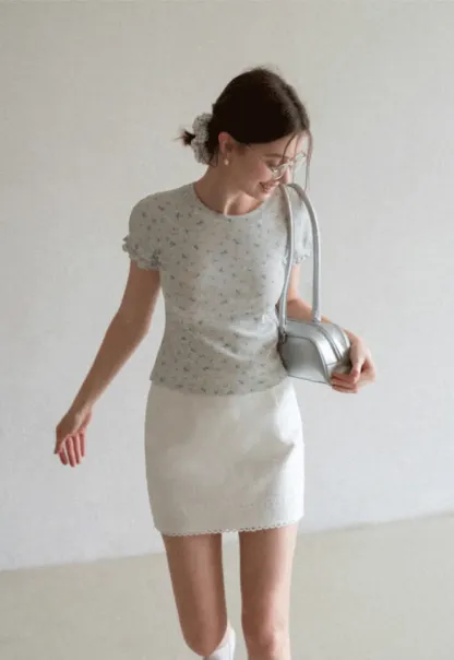 Mini skirt with lace trim at waist and hem