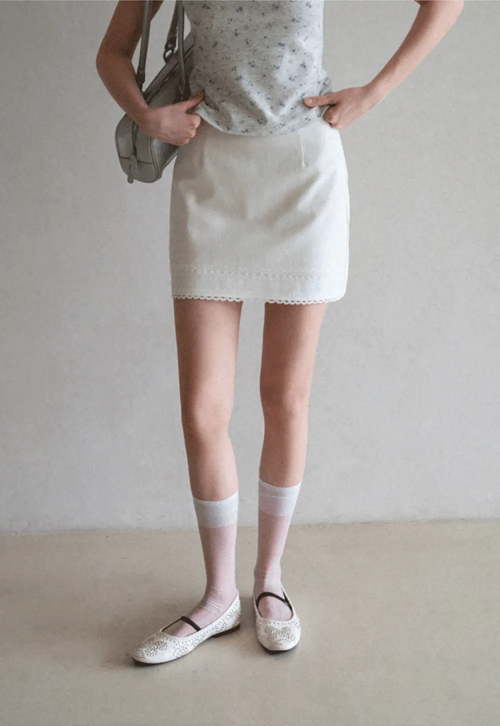 Mini skirt with lace trim at waist and hem