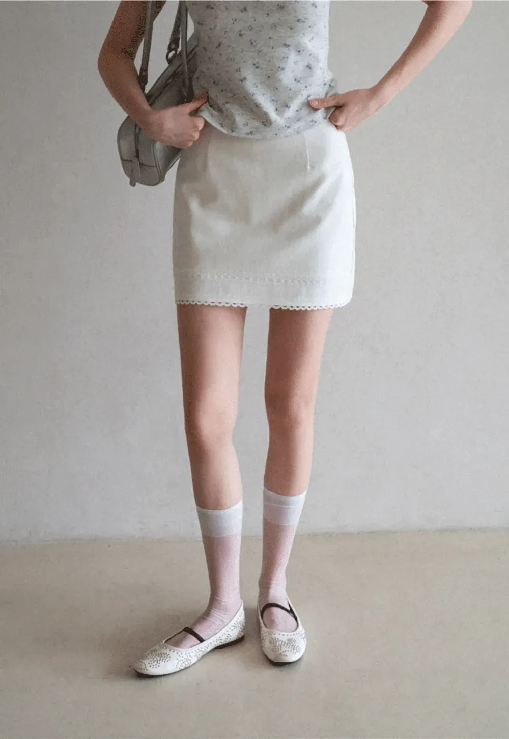 Mini skirt with lace trim at waist and hem