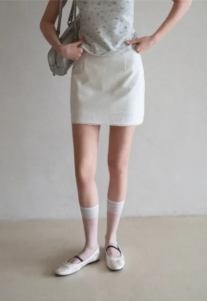 Mini skirt with lace trim at waist and hem