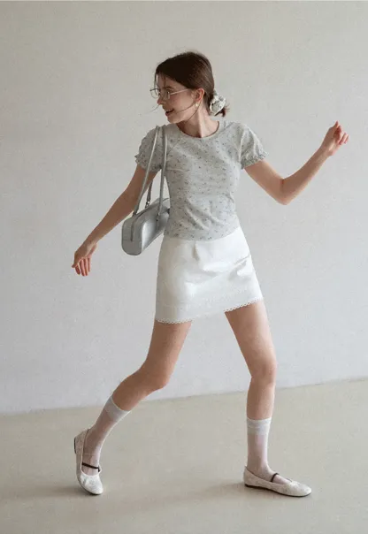 Mini skirt with lace trim at waist and hem