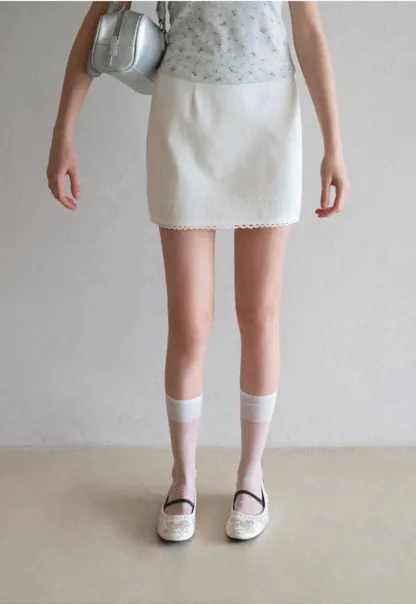 Mini skirt with lace trim at waist and hem
