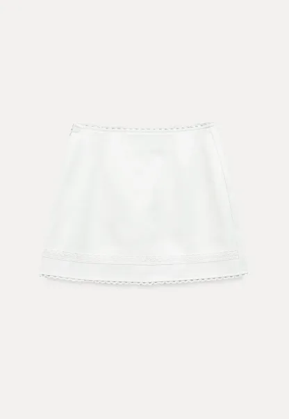 Mini skirt with lace trim at waist and hem