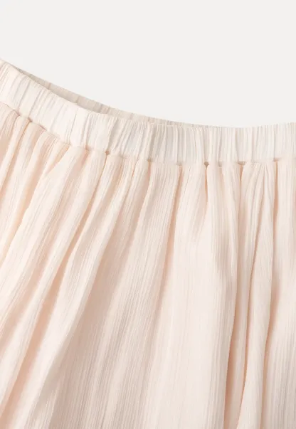 Pleated Asymmetrical Hem Skirt