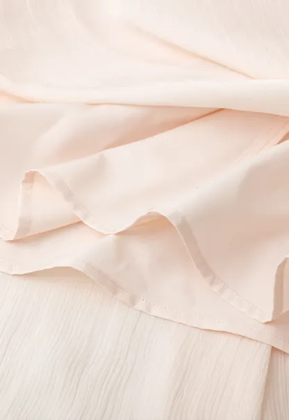 Pleated Asymmetrical Hem Skirt