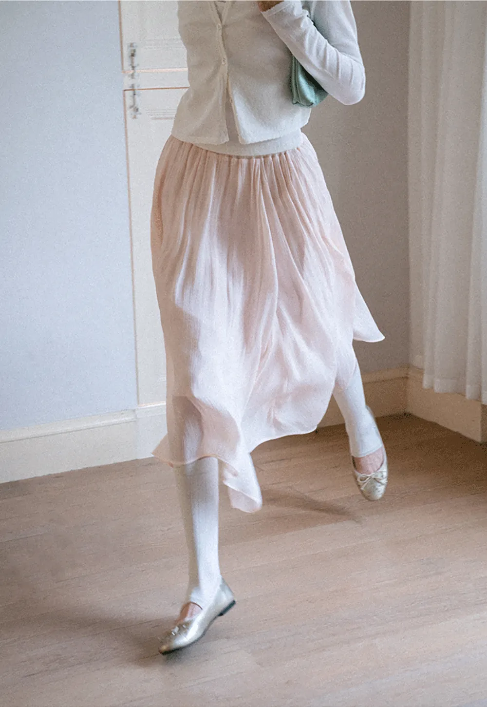 Pleated Asymmetrical Hem Skirt