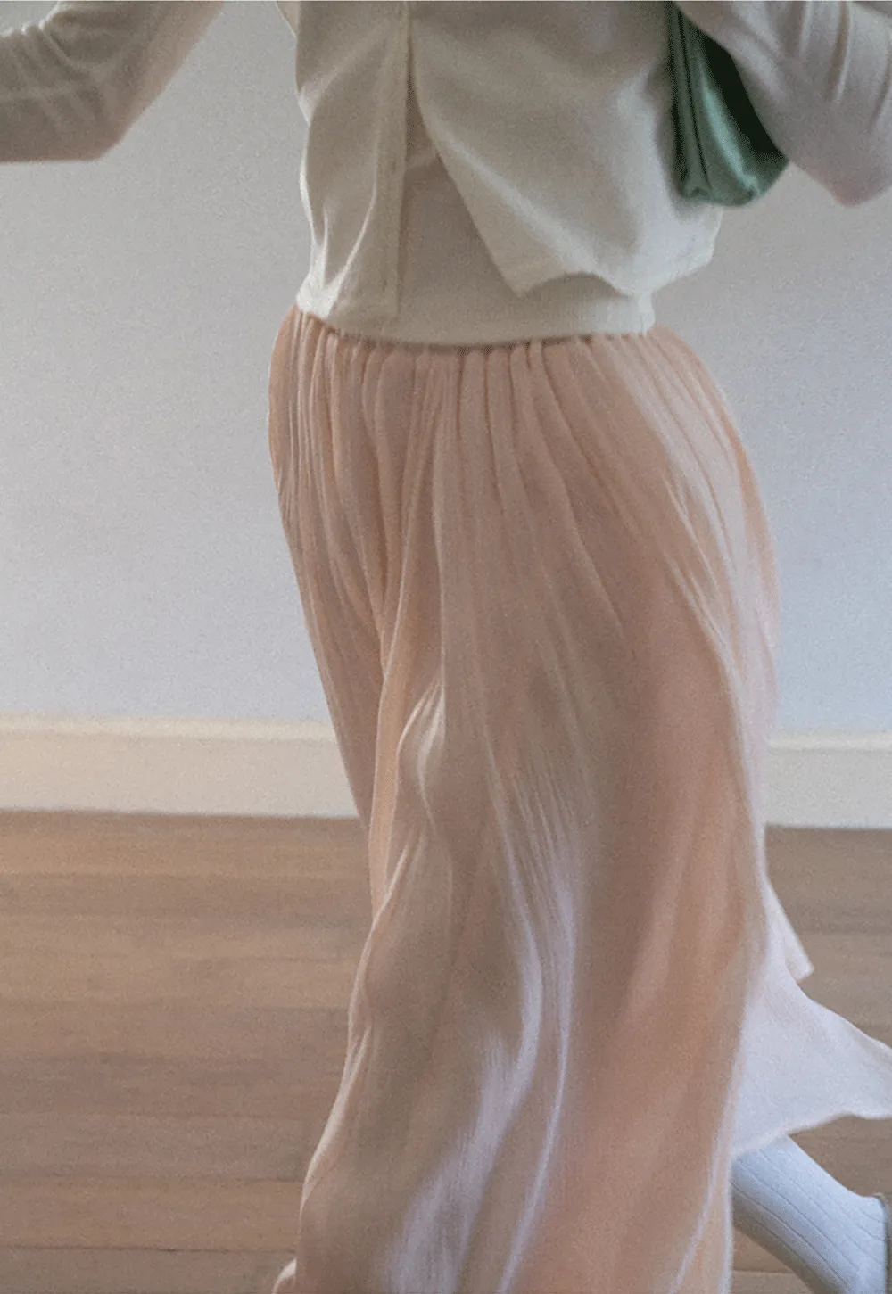 Pleated Asymmetrical Hem Skirt