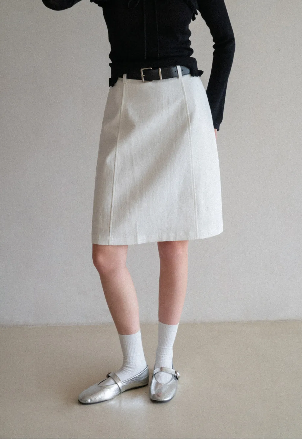 A-line knee length skirt with front seam and belt loop