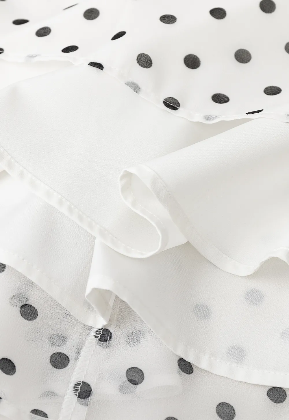 Polka dot pleated asymmetrical skirt