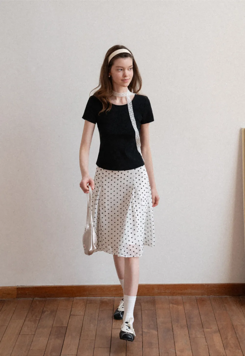 Polka dot pleated asymmetrical skirt