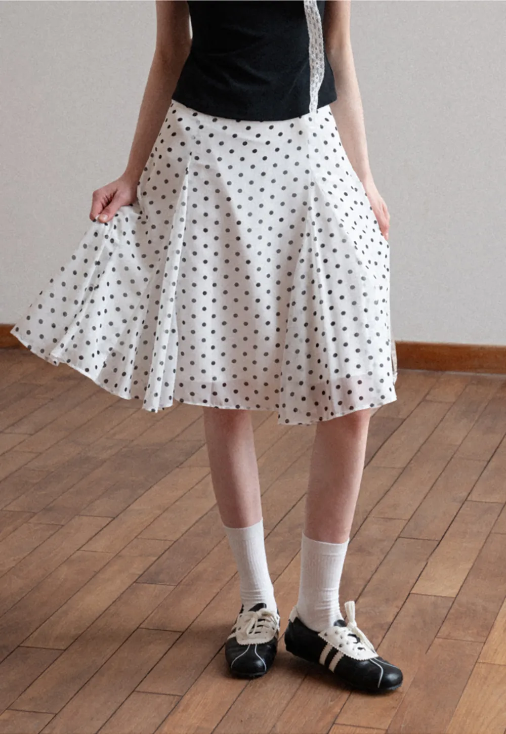 Polka dot pleated asymmetrical skirt