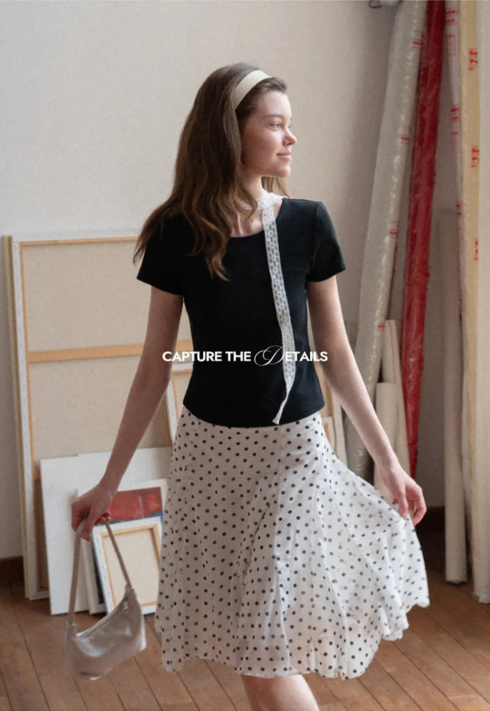 Polka dot pleated asymmetrical skirt