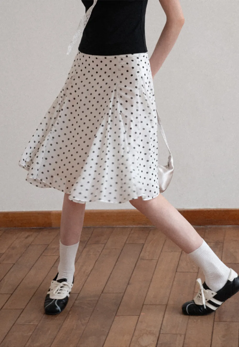 Polka dot pleated asymmetrical skirt