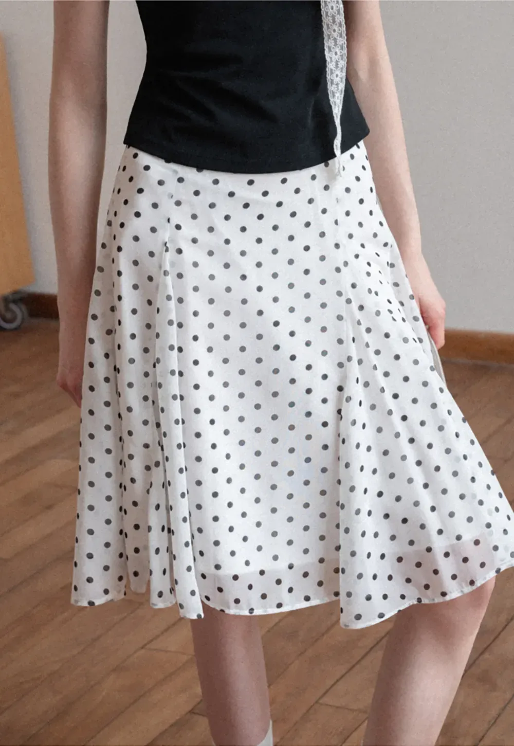 Polka dot pleated asymmetrical skirt