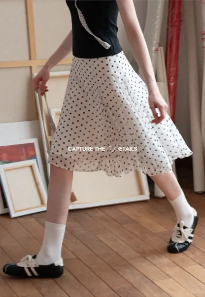 Polka dot pleated asymmetrical skirt