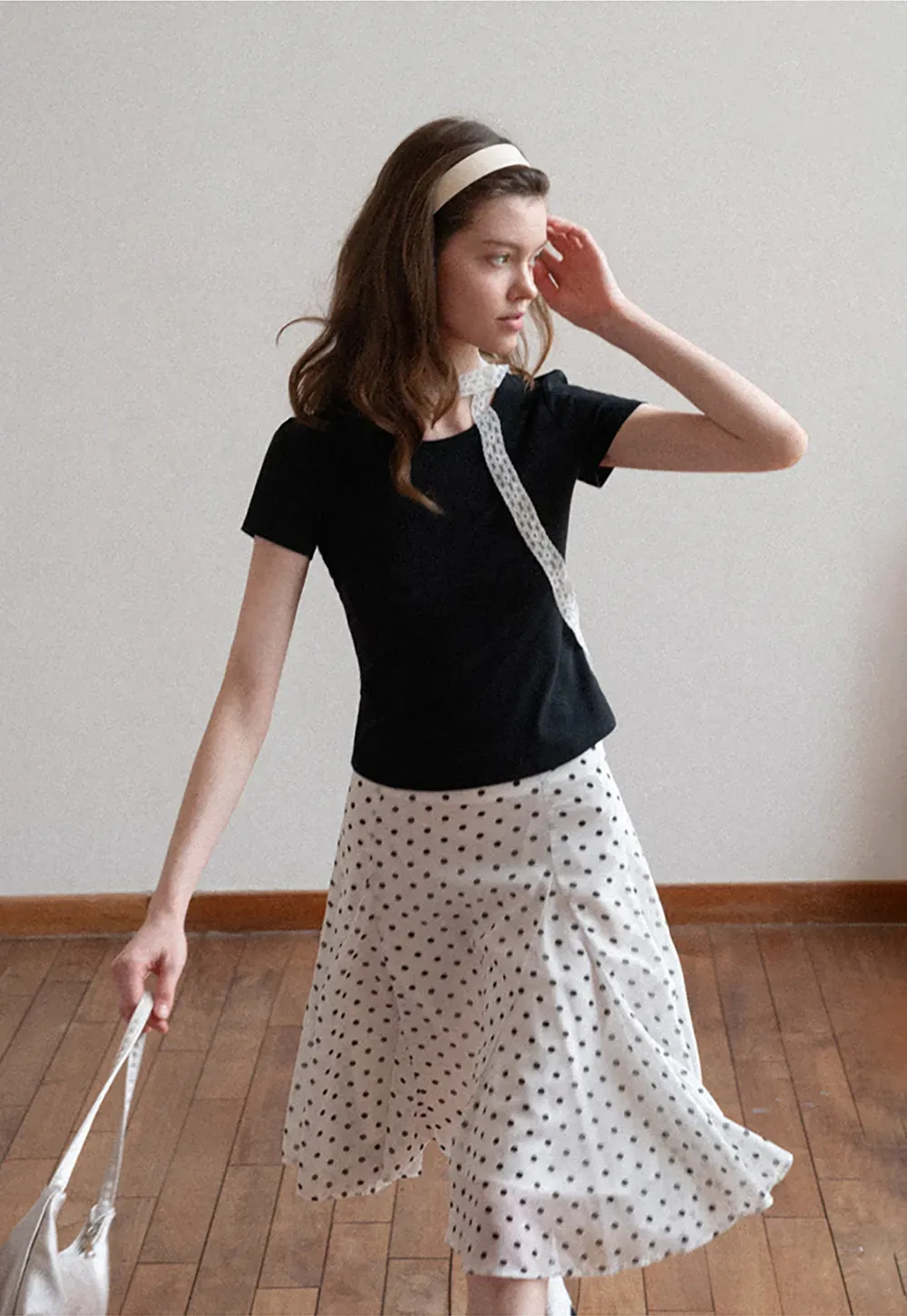 Polka dot pleated asymmetrical skirt
