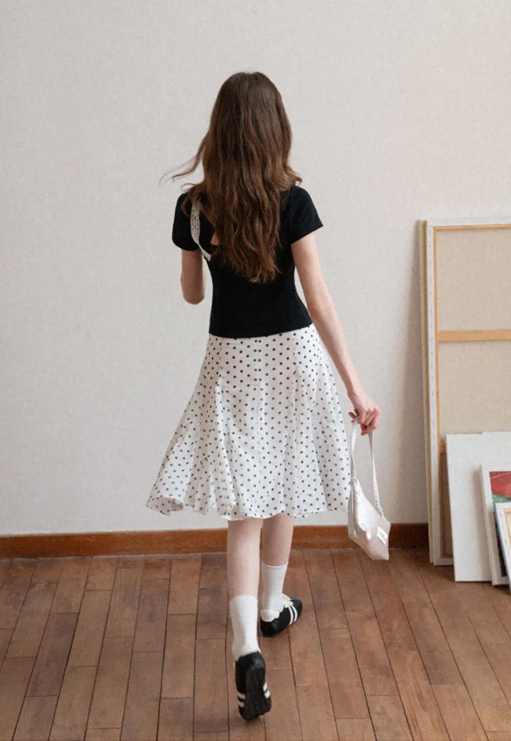 Polka dot pleated asymmetrical skirt