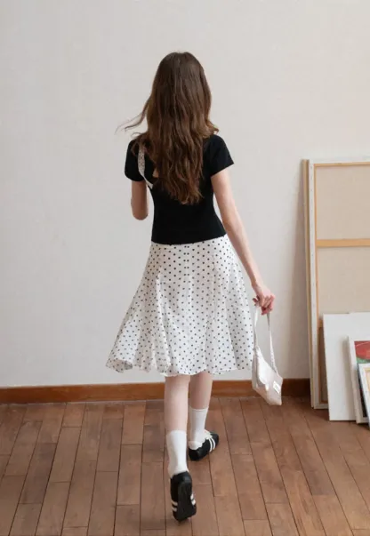 Polka dot pleated asymmetrical skirt