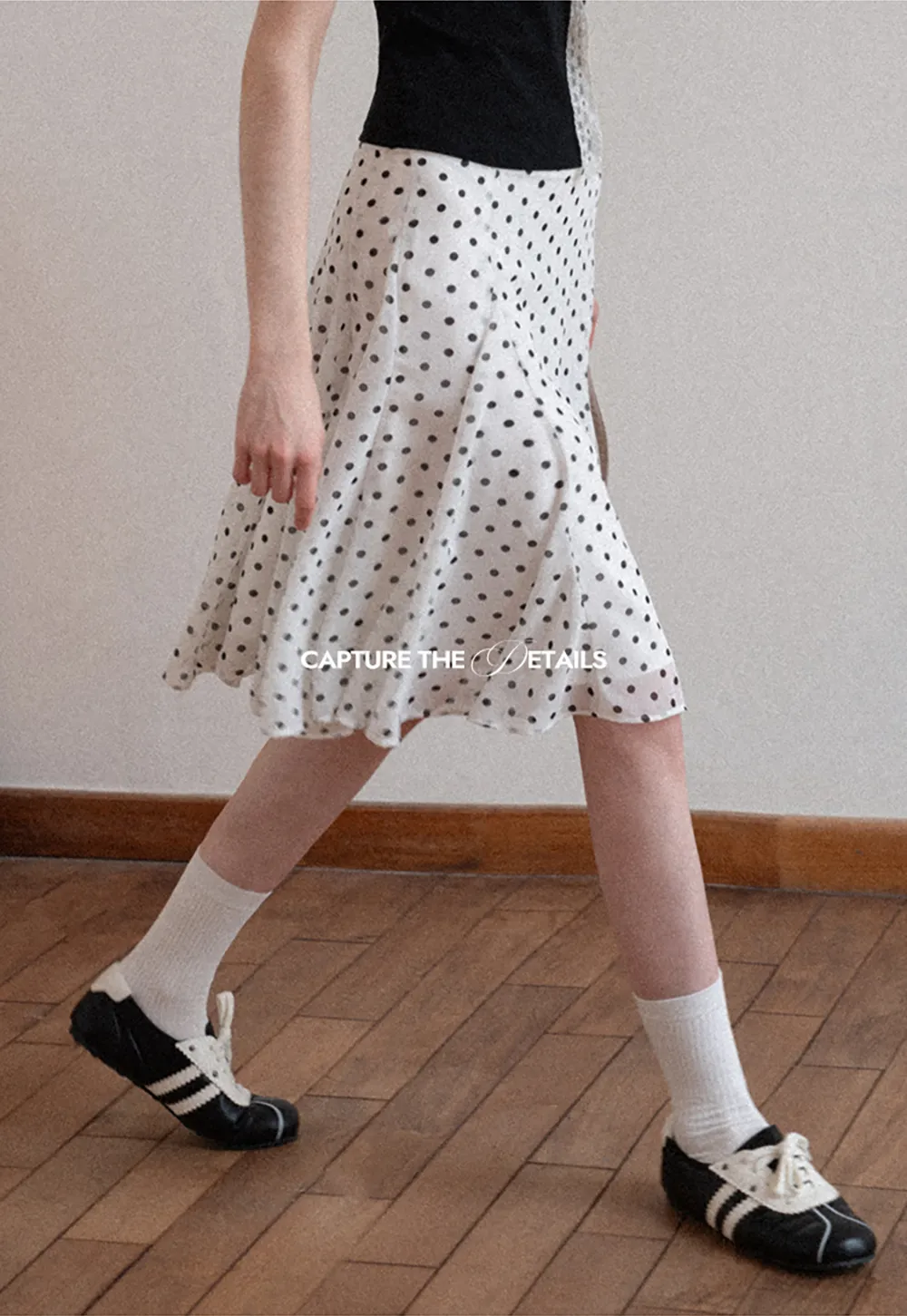 Polka dot pleated asymmetrical skirt
