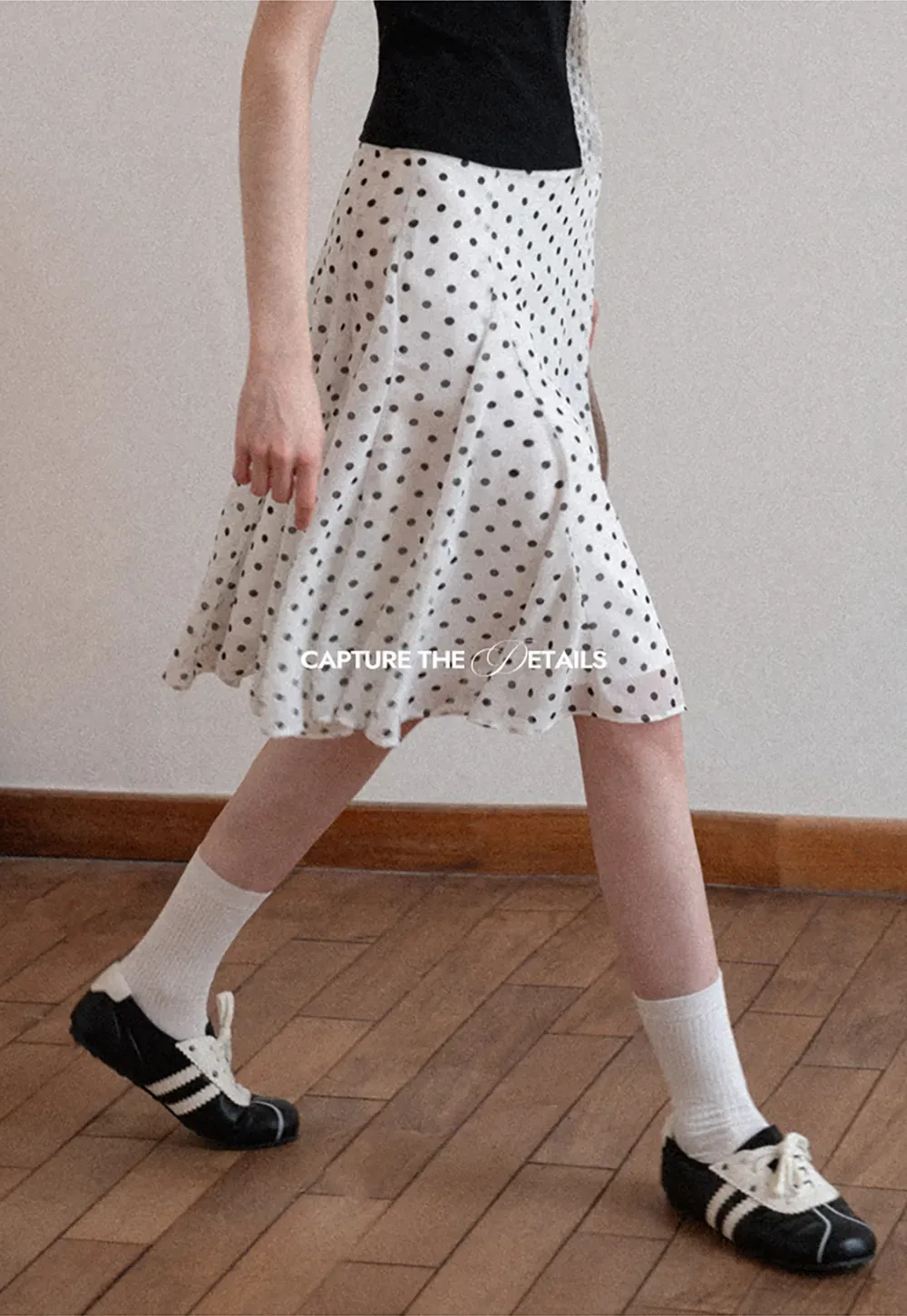 Polka dot pleated asymmetrical skirt