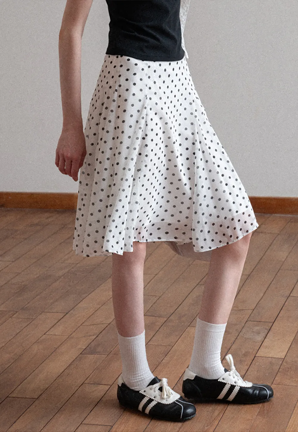 Polka dot pleated asymmetrical skirt