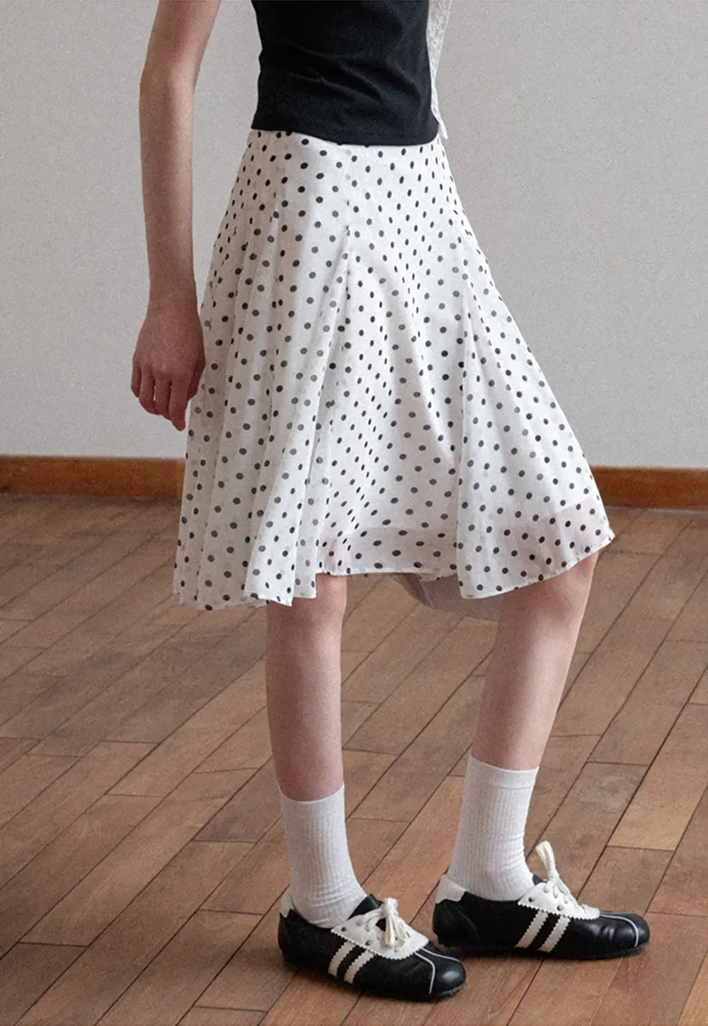 Polka dot pleated asymmetrical skirt