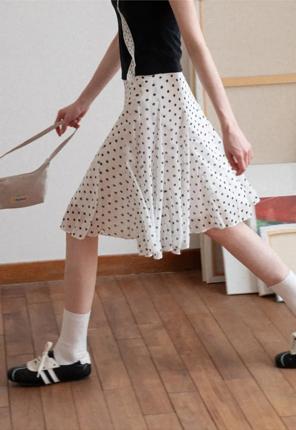 Polka dot pleated asymmetrical skirt