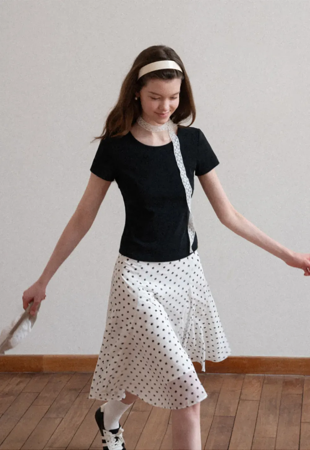 Polka dot pleated asymmetrical skirt