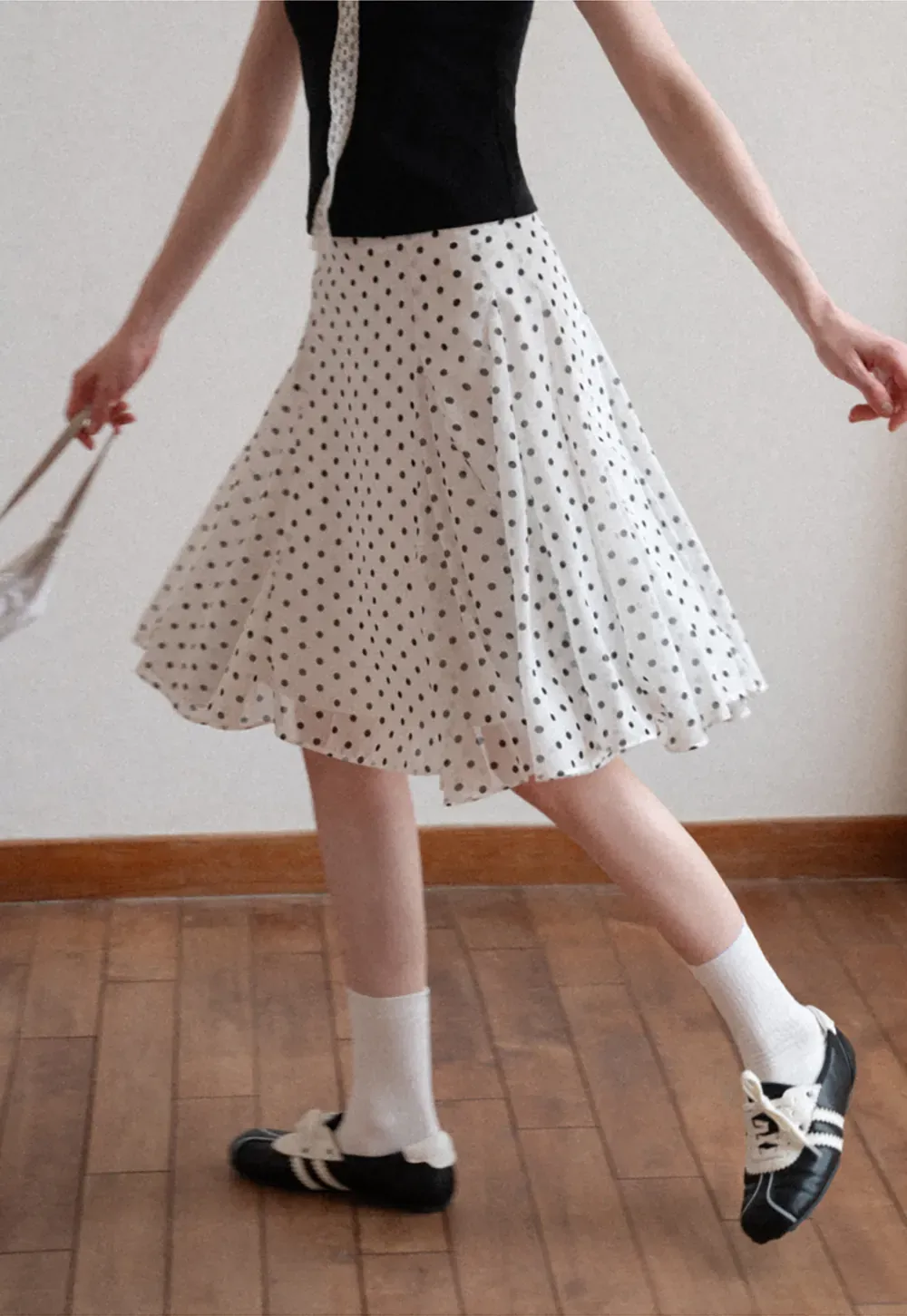 Polka dot pleated asymmetrical skirt
