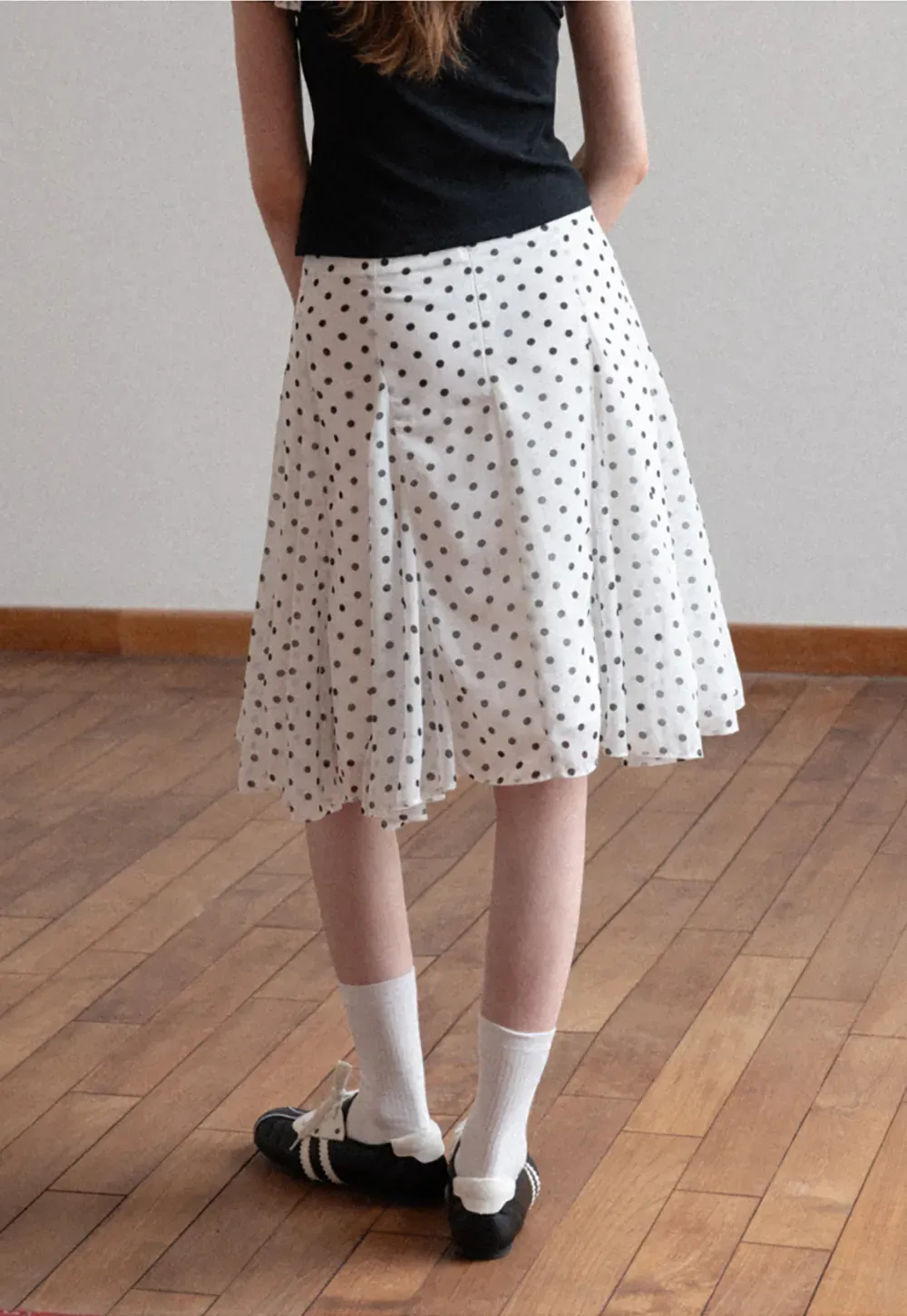 Polka dot pleated asymmetrical skirt