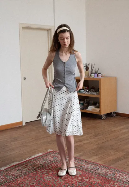 Polka dot pleated asymmetrical skirt