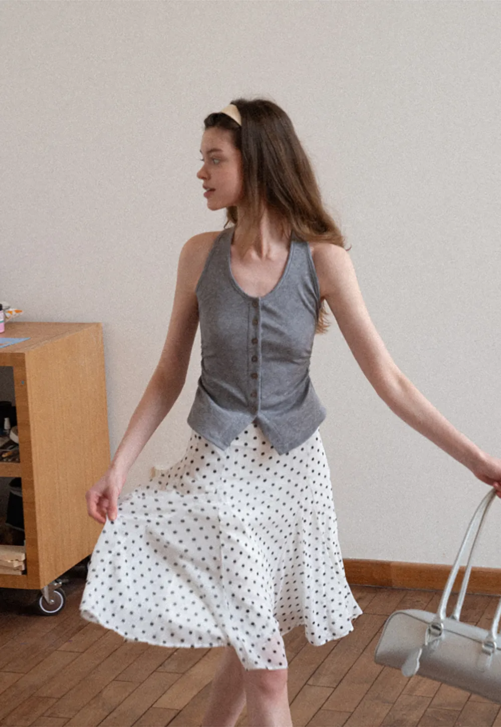 Polka dot pleated asymmetrical skirt