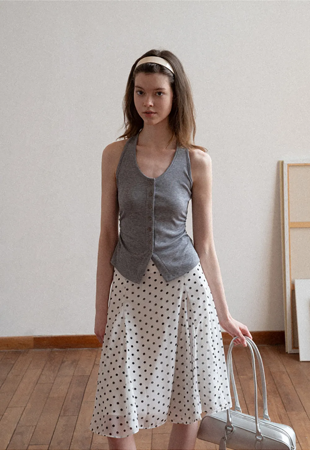 Polka dot pleated asymmetrical skirt