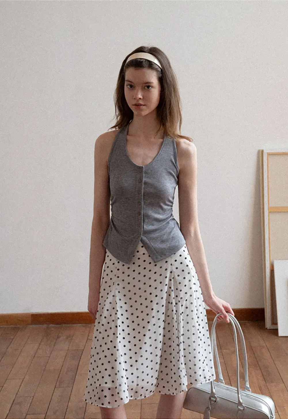 Polka dot pleated asymmetrical skirt