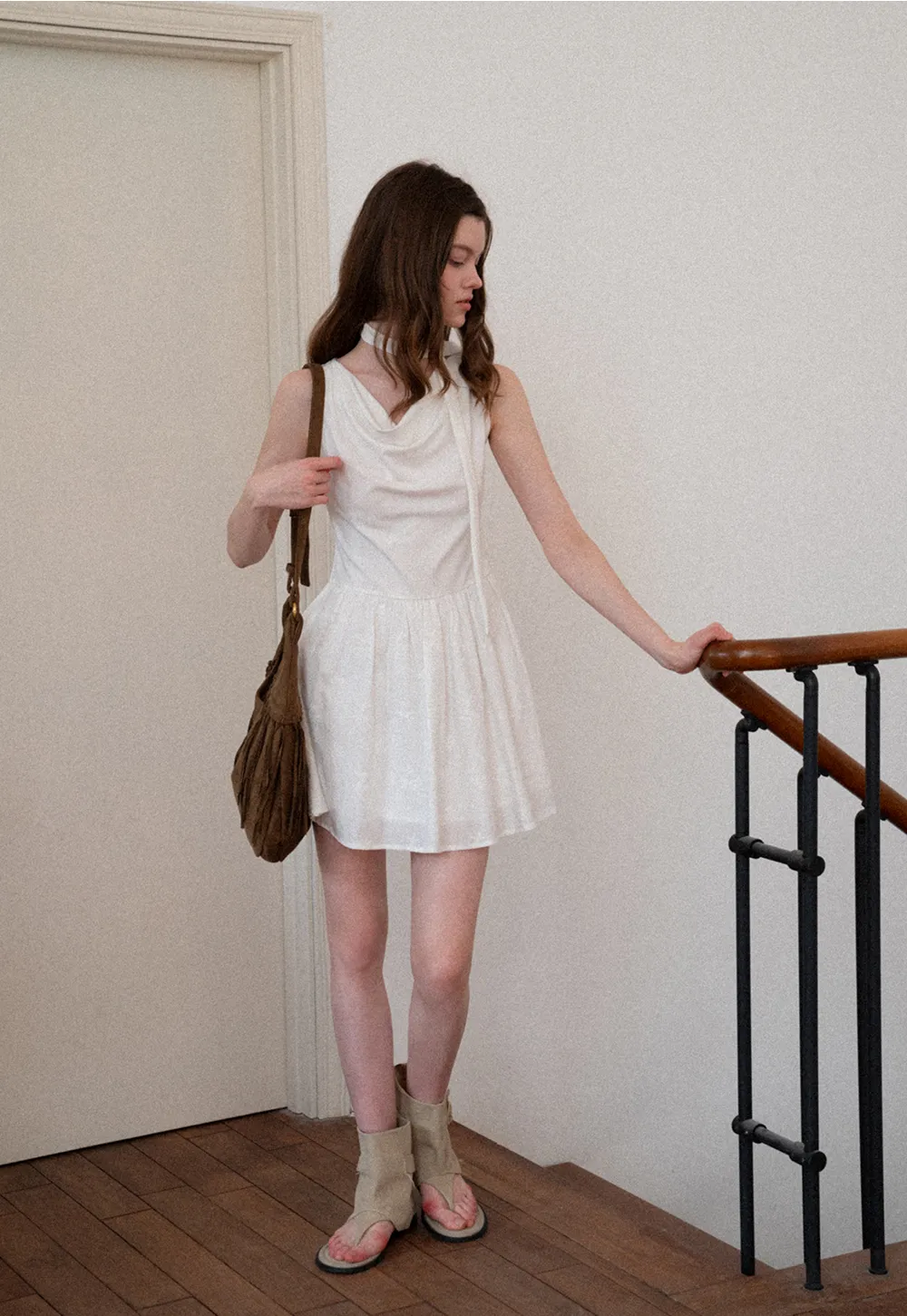 Sleeveless dress with halter neck and flared skirt