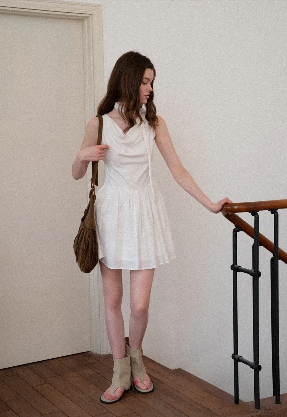 Sleeveless dress with halter neck and flared skirt