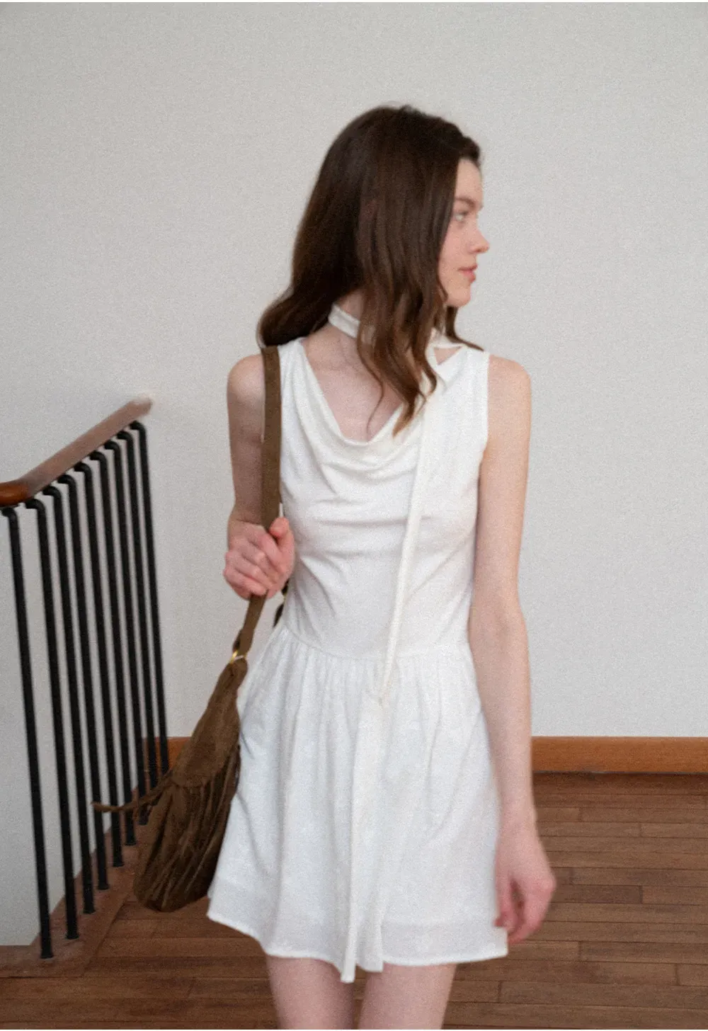 Sleeveless dress with halter neck and flared skirt