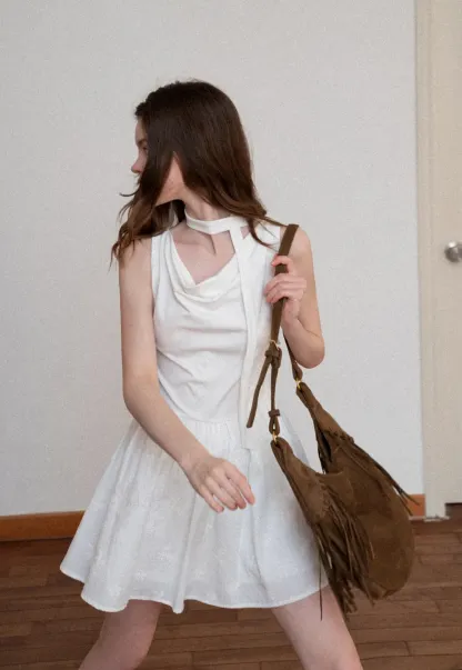 Sleeveless dress with halter neck and flared skirt