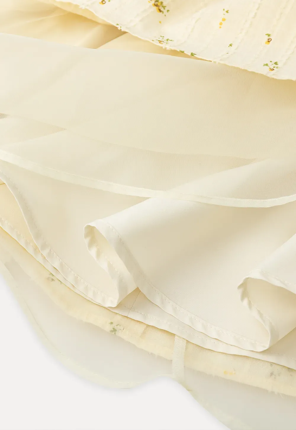 Sleeveless floral dress with layered skirt