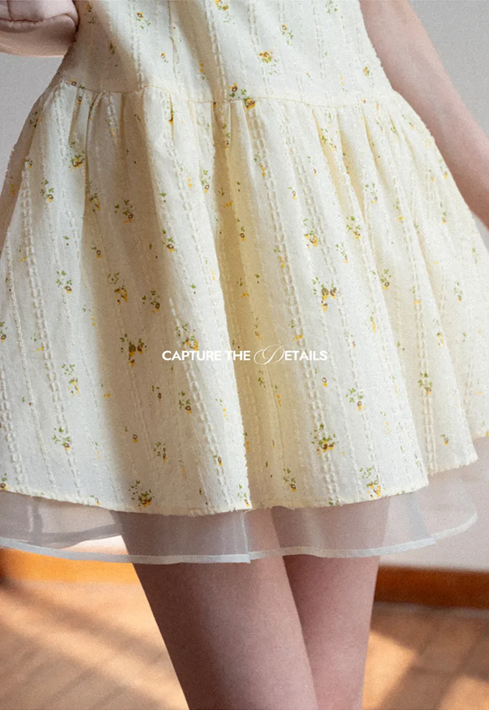 Sleeveless floral dress with layered skirt